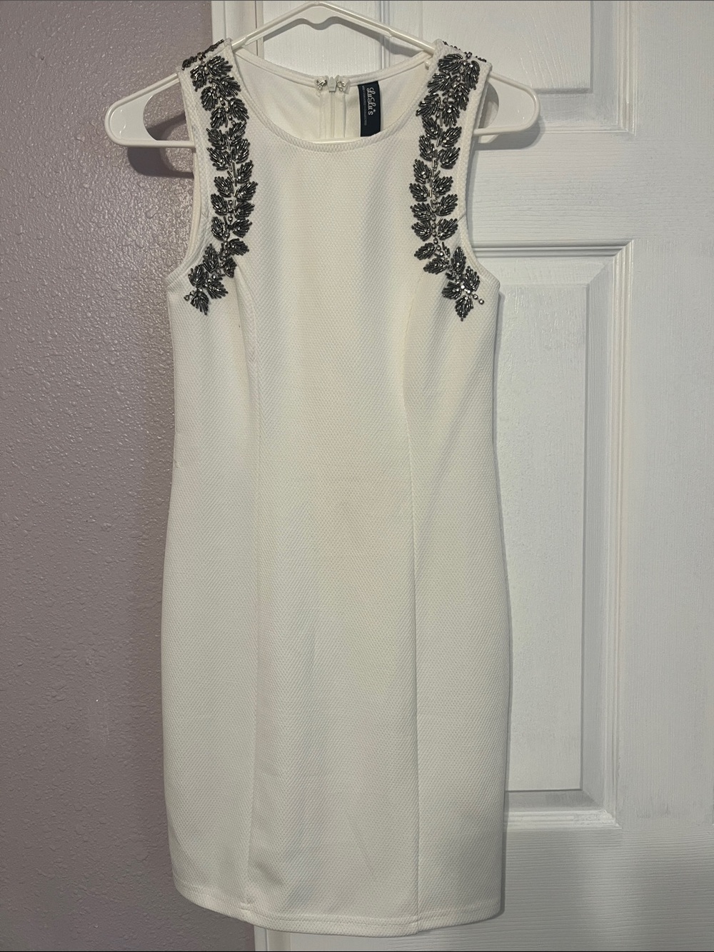 Lulu's White Sleeveless Mini Dress with Black Beaded Shoulder Appliqué
